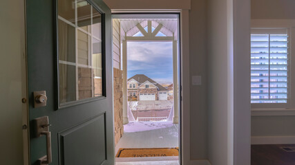 Panorama View through the open door from inside a home