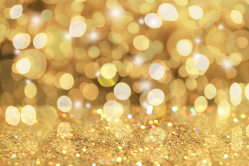 Gold glitter with bokeh effect as abstract background