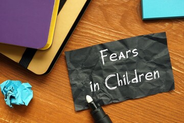 Conceptual photo about Fears in Children with handwritten phrase.