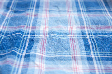 Checkered cloth texture. Squares on textile. Natural fabrics background.