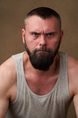 Obraz premium Strong bearded man. Portrait of a handsome man with a beard