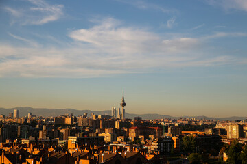 panoramic view of the city of Madrid, capital of Spain. Visible pollution in the air over the buildings and houses of the city. Climate change and environmental emergency context