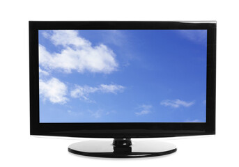 Modern plasma TV with skyscape on screen against white background