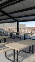 Vertical Tables with seats inside a gabled roof pavilion in South Jordan City in Utah