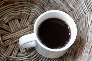 A cup of coffee in a basket
