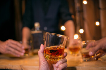 Barman pouring whiskey whiskey glass
