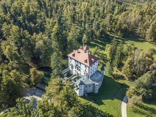Aerial shot of the  beautiful SneÅ¾nik white castle in Slovenia - obrazy, fototapety, plakaty