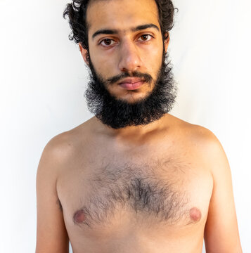 Muslim arabic man topless with fuzzy hair and beard