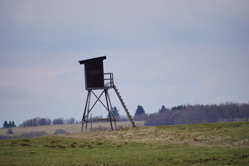 Naklejka premium foresters lodge on a field or hunting cabin