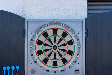 Target view of darts hanging on the wall of the terrace