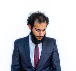 Muslim man wearing tuxedo and crossing his hands