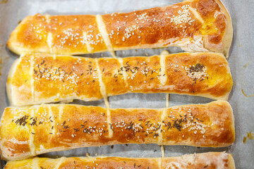 Home made rolls with salt and sesame on top and cumin