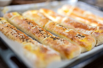 Home made rolls with salt and sesame on top and cumin
