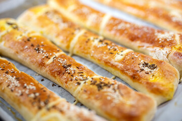 Home made rolls with salt and sesame on top and cumin