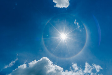 Fantastic beautiful sun halo phenomenon with sun ray and flare.