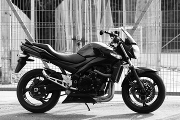 Fototapeta na wymiar Black motorcycle close-up on the street.