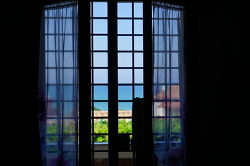 window with bars and curtains