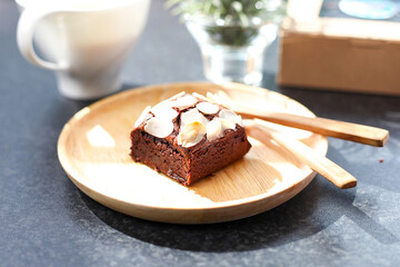 Brownies Chocolate with topping on woodplate selective focus.
