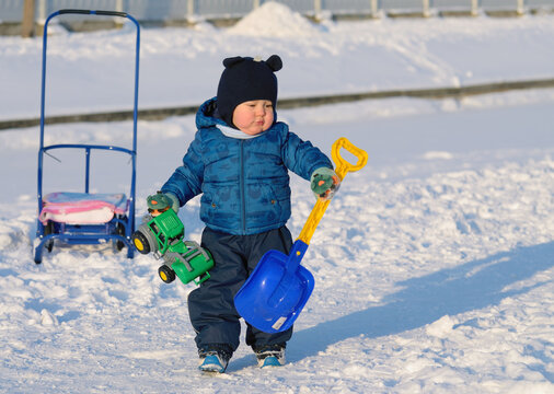 A small child plays on the Playground.