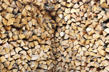 background of carefully stacked chopped firewood