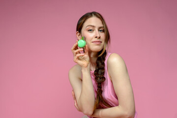 young caucasian woman and an apple macaron