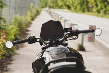 Black motorcycle close-up on the street.