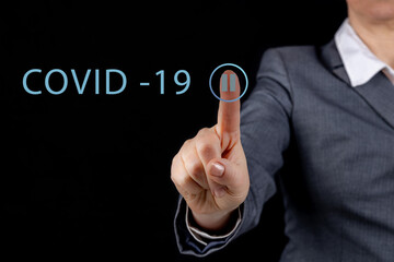 The world needs to be suspended due to the Covid 19 Corona virus, soft light the pause button of the index finger on the touch screen, The concept of stopping the Covid-19 virus.