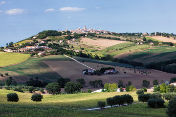 Fototapeta na wymiar Potenza Picena, Macerata, Marche. Veduta del borgo nel contesto rurale con fattoria