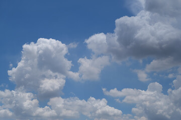Naklejka na ściany i meble Blue sky and white clouds, white clouds, blue on the background.