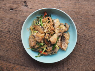 Stir fried fish with chili pepper, fingerroot and spring onion
