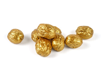 Golden walnuts on a white background