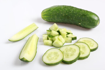 Slicied and diced cucumbers. Isolated on a white background.
