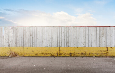 Simple background with wood wall fence yellow and white and sky
