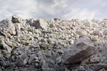 The rock background with big and small stones and rocks