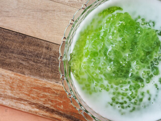 Top view sweet sago pearl in pandan juice and coconut milk