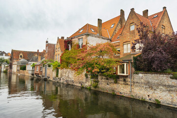 Fototapeta na wymiar Cityscape of Bruges. Beautiful canal and traditional houses in the old town. Belgium, Europe.