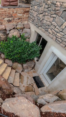 Vertical crop Steps leading down to a basement apartment
