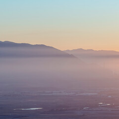 Fototapeta premium Square Wide foggy valley landscape in the morning