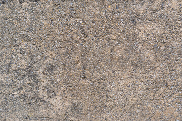 Old concrete wall with bumps and cracks