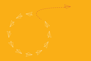 Think different. Think differently concept. Red airplane changing direction. New idea, change, trend, courage, creative solution, innovation and unique way concept.	