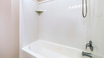Panorama Close up of bathroom bathtub with stainless steel shower head and faucet