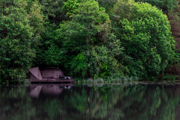 Fototapeta na wymiar Fishing camp on the lake shore