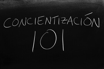 The words Concientización 101 on a blackboard in chalk.  Translation: Meditation 101