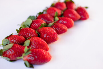 ripe red fresh red strawberries  on a white background