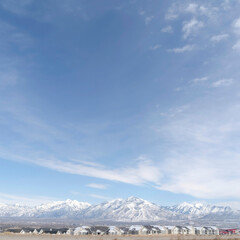 Square Panoramic view of South Jordan City neighborhood and Wasatch Mountains in winter