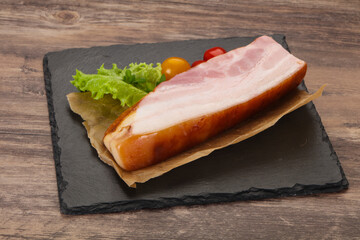 Smoked pork breast with salad leaves