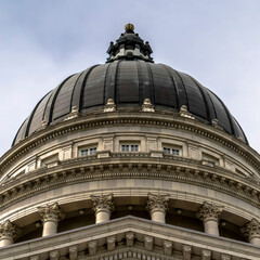 Fototapeta na wymiar Square crop Dome and pediment of Utah State Capital building in Salt Lake City against sky