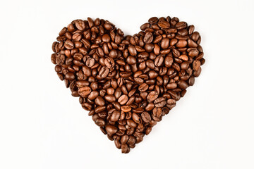 Heart made of coffee beans. Love concept of coffee beans. Isolated on white background.