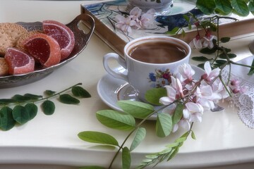 Still life with cup of coffee and cookies