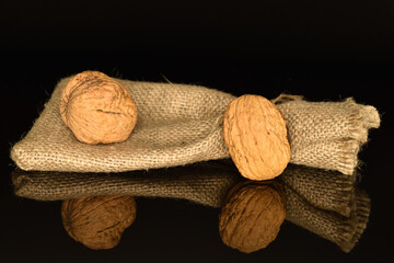 Ripe tasty, organic walnut, close-up, on a black background.